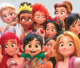 This image released by Disney shows the character Vanellope von Schweetz, voiced by Sarah Silverman, foreground center, posing for s selfie with Disney princesses in a scene from "Ralph Breaks the Internet." Filmmakers invited the original voice talent to return to the studio to help bring their characters to life. (Disney via AP)